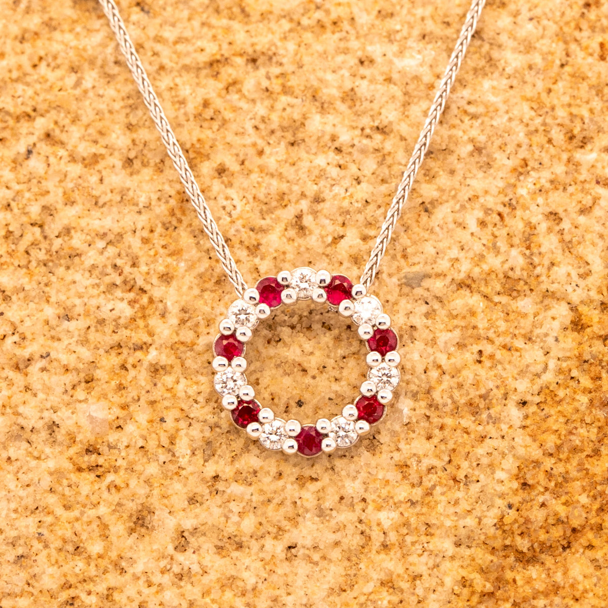 9ct White Gold Ruby & 0.16ct Diamond Circle Pendant